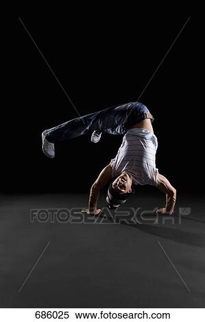 Stock Photography - A B-boy doing a Handstand Freeze breakdance move. Fotosearch