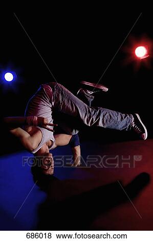 A B-boy doing a Headstand Freeze breakdance move View Large Photo Image Stock Photo - A B-boy doing a Headstand Freeze breakdance move. Fotosearch