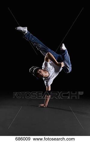 A B-boy doing a K-Kick breakdance move View Large Photo Image Stock Photo - A B-boy doing a K-Kick breakdance move. Fotosearch