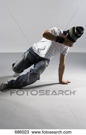 A B-boy trying to do a breakdance move View Large Photo Image Stock Image - A B-boy trying to do a breakdance move. Fotosearch