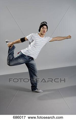 Stock Photo - Portrait of a B-boy stretching. Fotosearch