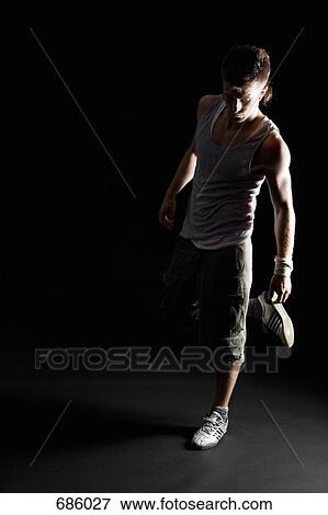 Stock Photo - Portrait of a B-boy stretching. Fotosearch