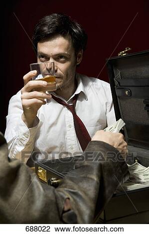 Two man doing a shady business deal View Large Photo Image Stock Image - Two man doing a shady business deal. Fotosearch