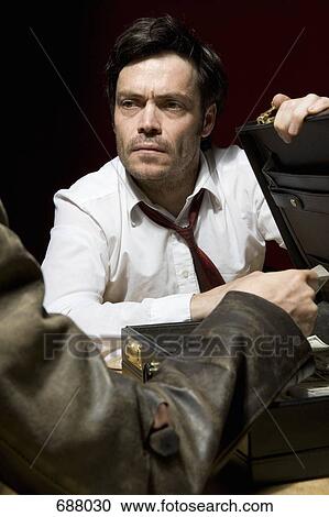 Two men doing business over a suitcase full of money View Large Photo Image Stock Image - Two men doing business over a suitcase full of money. Fotosearch