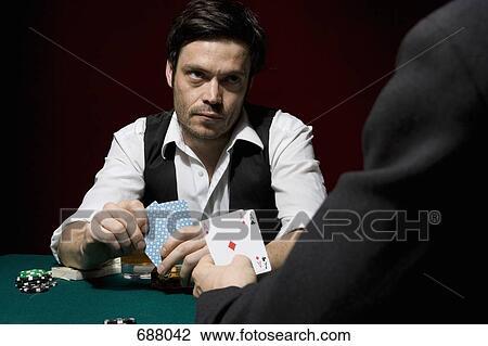 Two men playing poker at a high stakes game View Large Photo Image Stock Image - Two men playing poker at a high stakes game. Fotosearch