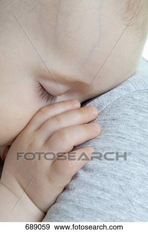 A baby sleeping View Large Photo Image Stock Photo - A baby sleeping. Fotosearch