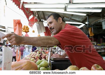 A market vendor View Large Photo Image Stock Image - A market vendor. Fotosearch