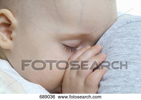 A sleeping baby View Large Photo Image Stock Photograph - A sleeping baby. Fotosearch