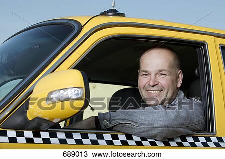 A taxi driver sitting in his car and smiling View Large Photo Image Stock Image - A taxi driver sitting in his car and smiling. Fotosearch