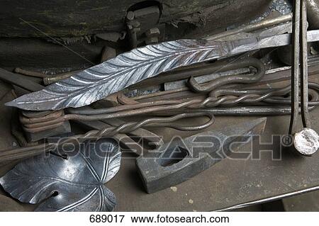 Stock Photo - Pieces of crafted metal and metalwork tools. Fotosearch