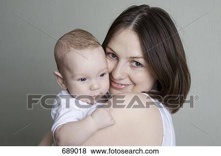 Portrait of a mother and baby View Large Photo Image Stock Photo - Portrait of a mother and baby. Fotosearch