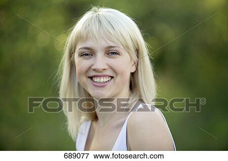 Portrait of a woman smiling View Large Photo Image Stock Photo - Portrait of a woman smiling. Fotosearch