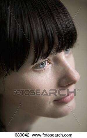 Portrait of a young woman with blue eyes View Large Photo Image Stock Image - Portrait of a young woman with blue eyes. Fotosearch