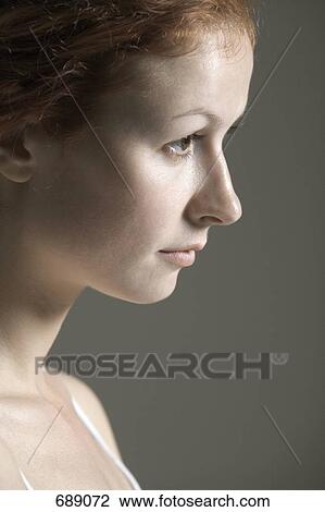 Portrait of a young woman with red hair View Large Photo Image Stock Image - Portrait of a young woman with red hair. Fotosearch