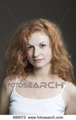Portrait of a young woman with red hair View Large Photo Image Stock Image - Portrait of a young woman with red hair. Fotosearch