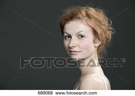 Portrait of a young woman with red hair View Large Photo Image Stock Photo - Portrait of a young woman with red hair. Fotosearch
