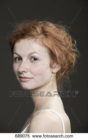 Stock Photography - Portrait of a young woman with red hair. Fotosearch