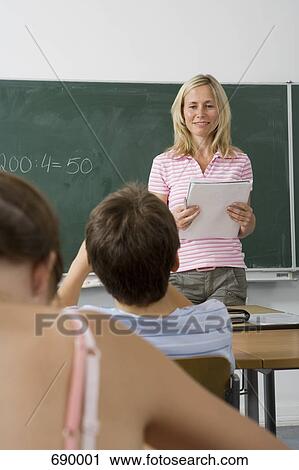 A teacher teaching a class, over the shoulder view View Large Photo Image Stock Image - A teacher teaching a class, over the shoulder view. Fotosearch
