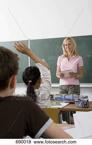 A teacher teaching a class, over the shoulder view View Large Photo Image Stock Photo - A teacher teaching a class, over the shoulder view. Fotosearch