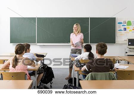 Stock Photo - Teacher in front of her class. Fotosearch