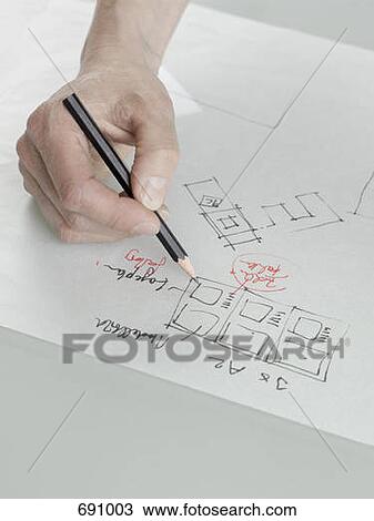 An architect sketching a plan View Large Photo Image Stock Image - An architect sketching a plan. Fotosearch