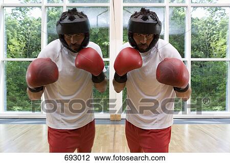 A boxer standing next to a mirror View Large Photo Image Stock Image - A boxer standing next to a mirror. Fotosearch