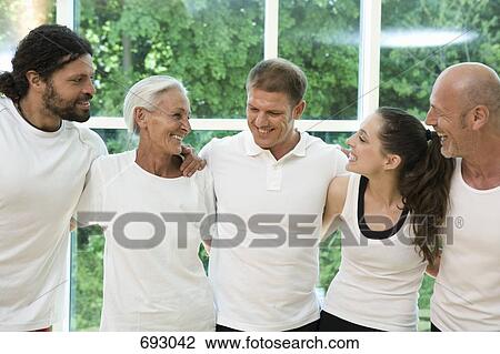 A group of people with their arms around each other View Large Photo Image Stock Image - A group of people with their arms around each other. Fotosearch