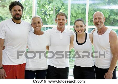 A group of people with their arms around each other View Large Photo Image Stock Photo - A group of people with their arms around each other. Fotosearch