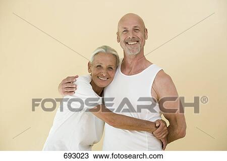 A senior woman and mature man embracing View Large Photo Image Stock Image - A senior woman and mature man embracing. Fotosearch