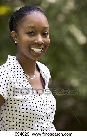Portrait of a young woman, outdoors View Large Photo Image Stock Image - Portrait of a young woman, outdoors. Fotosearch