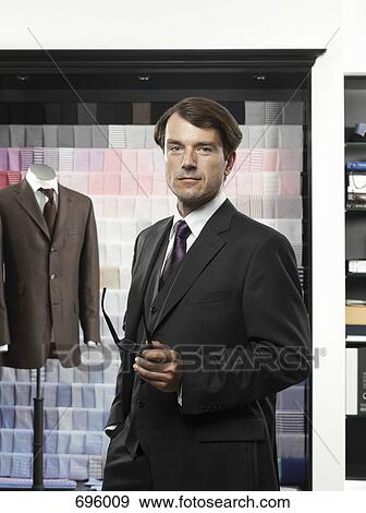 A man in a tailor's studio View Large Photo Image Stock Photo - A man in a tailor's studio. Fotosearch