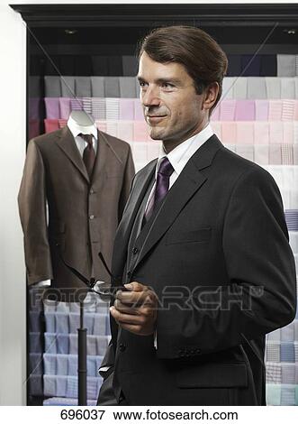 A man in a tailor's studio View Large Photo Image Stock Photo - A man in a tailor's studio. Fotosearch
