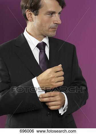 Stock Photograph - A man wearing a suit. Fotosearch