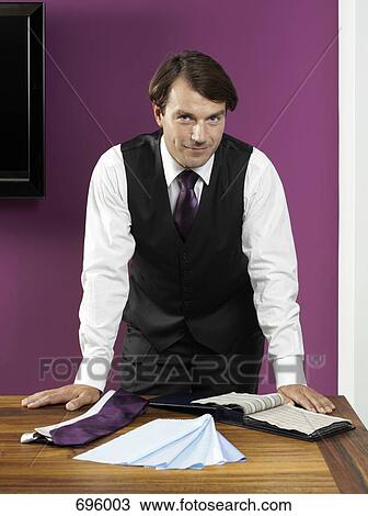 A tailor with samples of fabric View Large Photo Image Stock Image - A tailor with samples of fabric. Fotosearch