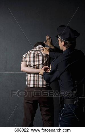 A criminal being arrested View Large Photo Image Stock Image - A criminal being arrested. Fotosearch