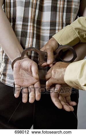 A man being arrested View Large Photo Image Stock Image - A man being arrested. Fotosearch