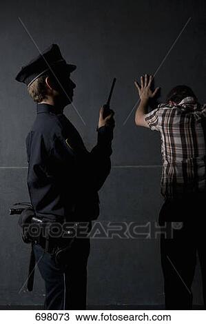 A police officer arresting a criminal View Large Photo Image Stock Image - A police officer arresting a criminal. Fotosearch