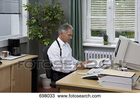 A police officer working in an office View Large Photo Image Stock Image - A police officer working in an office. Fotosearch