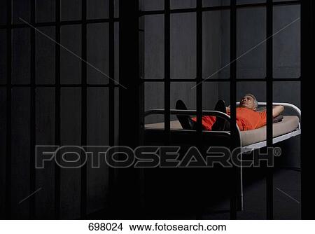A prisoner in his prison cell View Large Photo Image Picture - A prisoner in his prison cell. Fotosearch