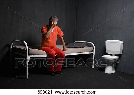 A prisoner in his prison cell View Large Photo Image Stock Image - A prisoner in his prison cell. Fotosearch