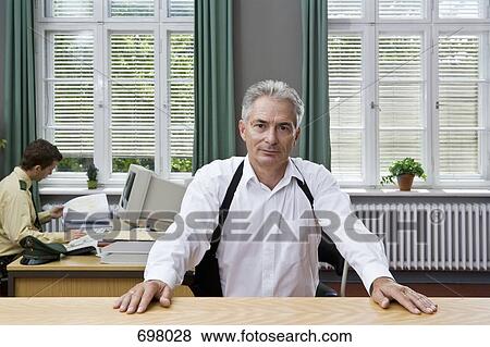 Stock Photo - Two police officers working in an office. Fotosearch