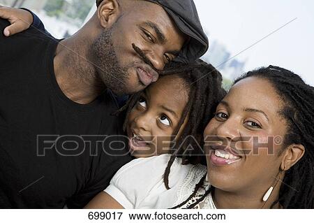 Two parents and their son goofing around View Large Photo Image Stock Photo - Two parents and their son goofing around. Fotosearch