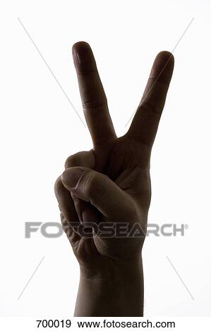 A hand making a peace sign View Large Photo Image Stock Photo - A hand making a peace sign. Fotosearch