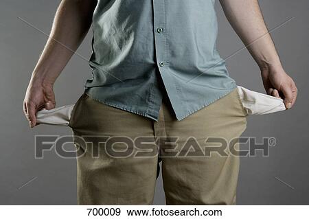 A man showing his empty pockets View Large Photo Image Stock Photo - A man showing his empty pockets. Fotosearch