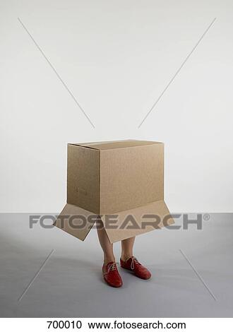 A person standing inside a box View Large Photo Image Stock Image - A person standing inside a box. Fotosearch