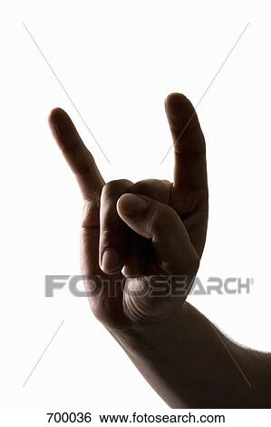 Hand making a rock and roll sign View Large Photo Image Stock Photograph - Hand making a rock and roll sign. Fotosearch