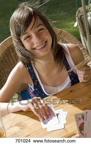 Picture - A father and daughter playing a card game, outdoors. Fotosearch
