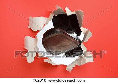 A foot kicking through a wall View Large Photo Image Stock Image - A foot kicking through a wall. Fotosearch