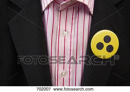 A person wearing a toxic warning badge on his jacket View Large Photo Image Stock Photo - A person wearing a toxic warning badge on his jacket. Fotosearch