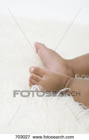 A baby's bare feet View Large Photo Image Stock Photo - A baby's bare feet. Fotosearch